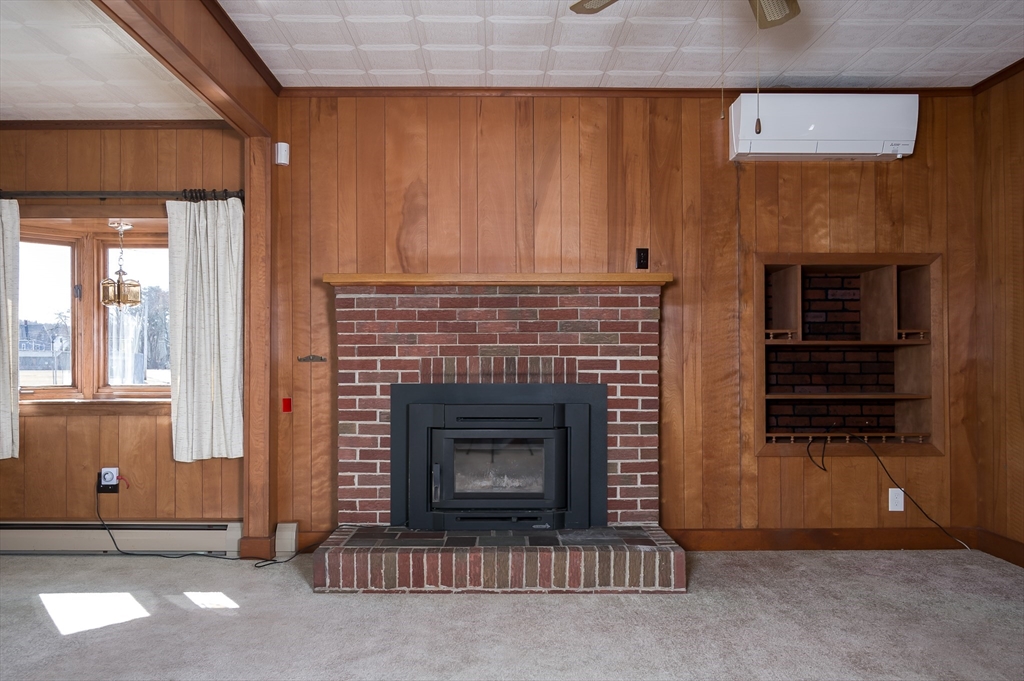 2 Worcester Street Clinton, MA 01510 - Photo 7 of 26 a living room with a fireplace in it