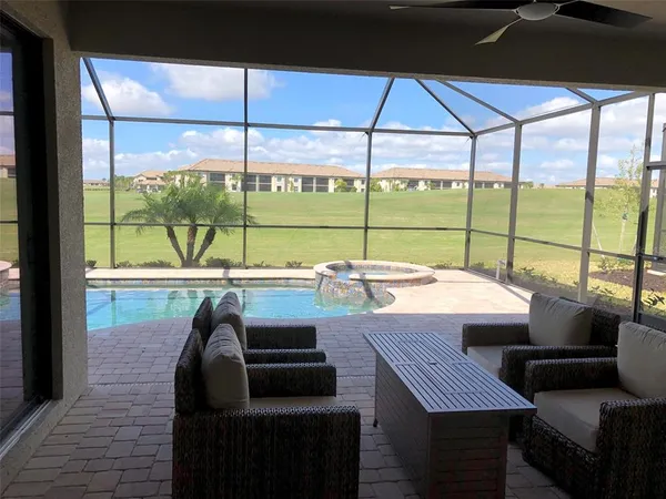 a view of a dining room with furniture and window