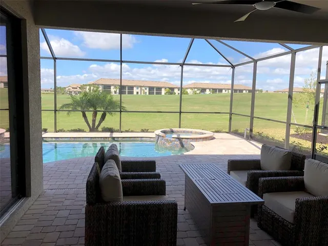 a view of a dining room with furniture and window