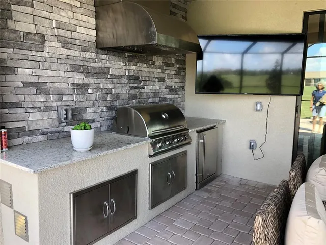 a kitchen with a stove and a microwave