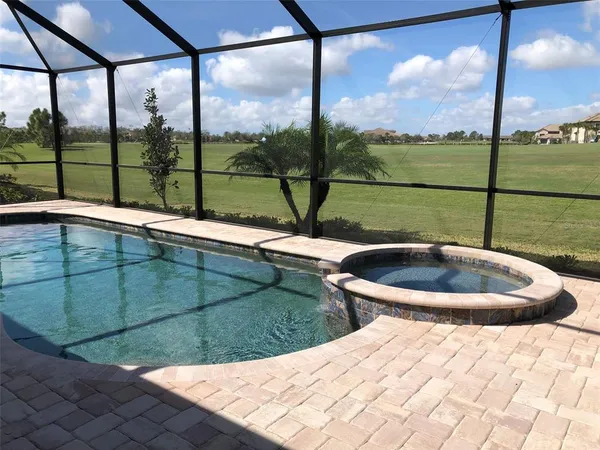 a view of a swimming pool with a sitting space
