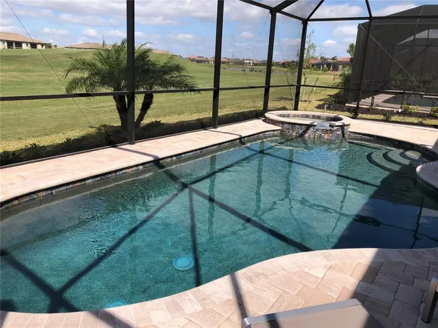 a view of swimming pool from a balcony