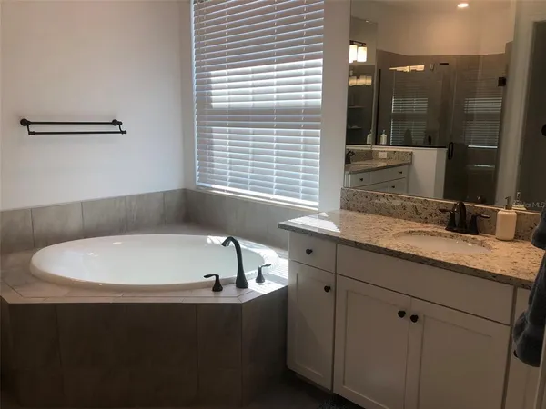 a bathroom with a bathtub and a sink