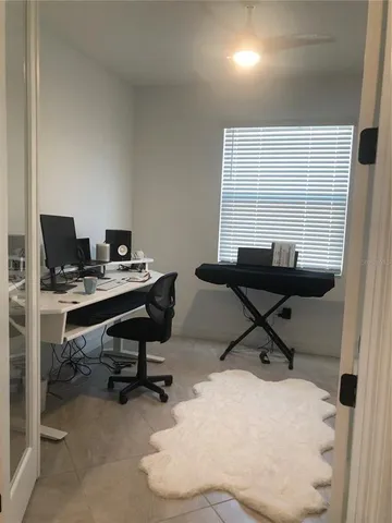 a view of a workspace with furniture