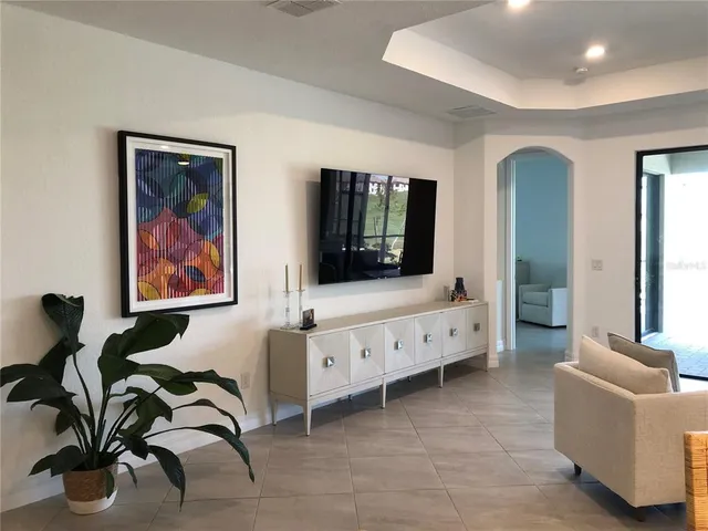 a living room with furniture and window