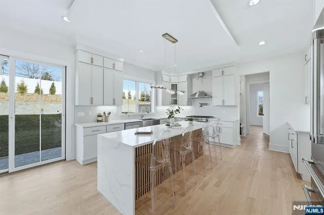 a kitchen with a sink stove and refrigerator