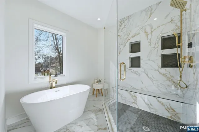 a room with a window and a chandelier