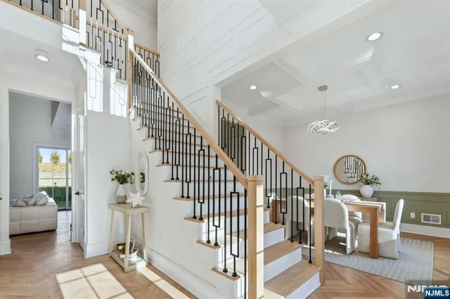 a view of entryway livingroom and hall with wooden floor