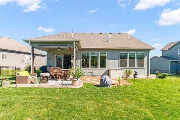 $550,000 | 1713 Northeast Ravenwood Drive, Lee's Summit, MO 64086