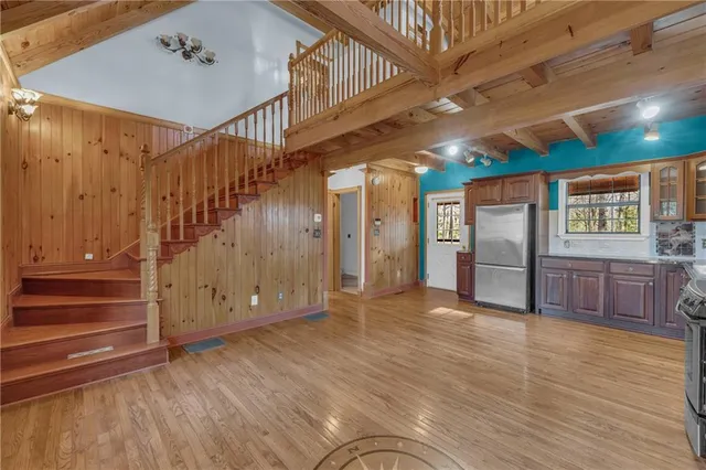 a view of an entryway with wooden floor