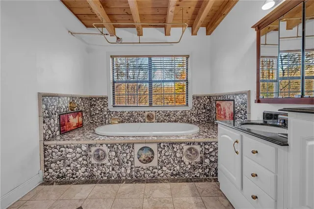 a bathroom with a sink a vanity and a mirror