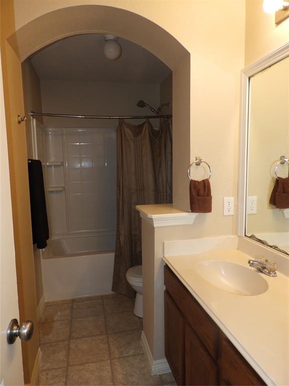 5812 Quicksilver Drive McKinney, TX 75070 - Photo 16 of 17 a bathroom with a sink a toilet and shower