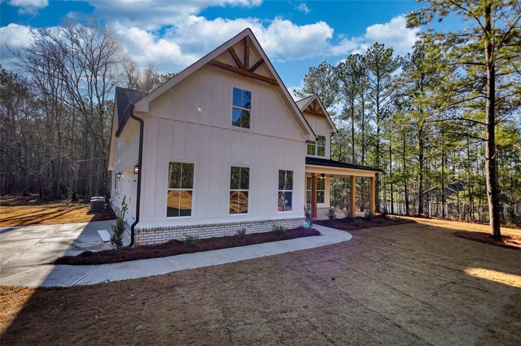 160 Loyd Road Mansfield, GA 30055 - Photo 12 of 82 a view of a house with backyard and trees