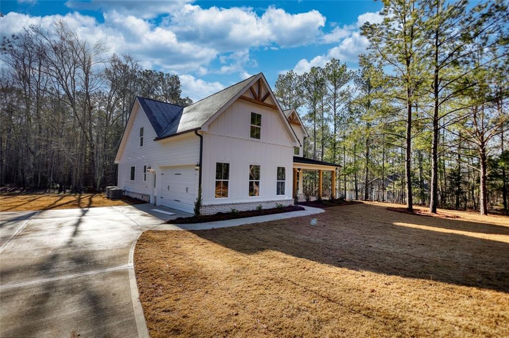 160 Loyd Road Mansfield, GA 30055 - Photo 2 of 82 a view of a house with a yard covered in snow