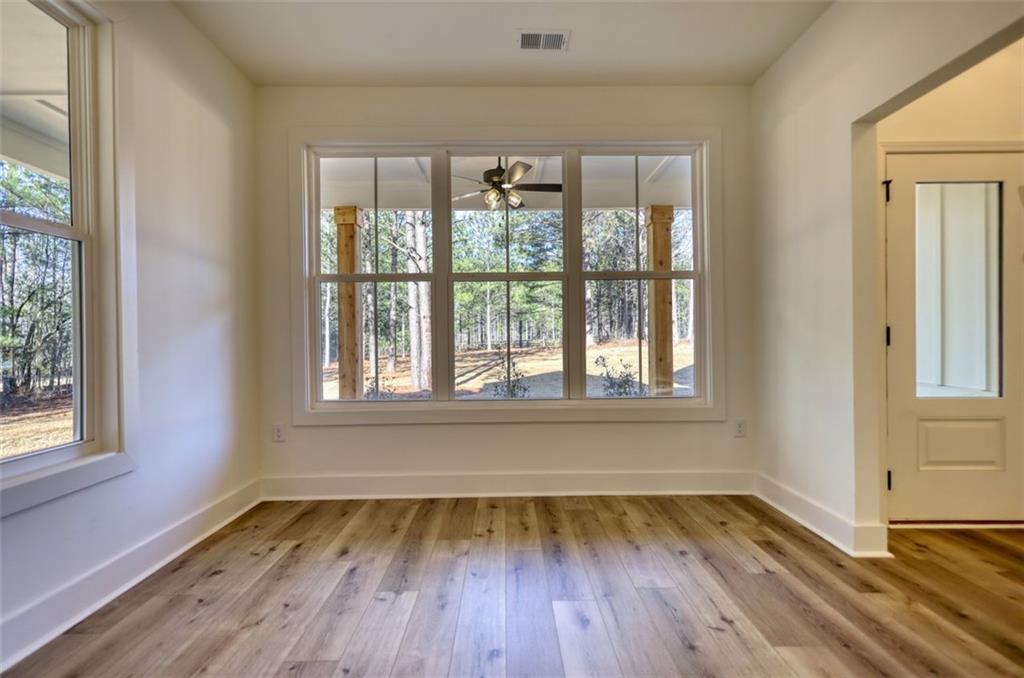 160 Loyd Road Mansfield, GA 30055 - Photo 25 of 82 a view of an empty room with wooden floor and a window