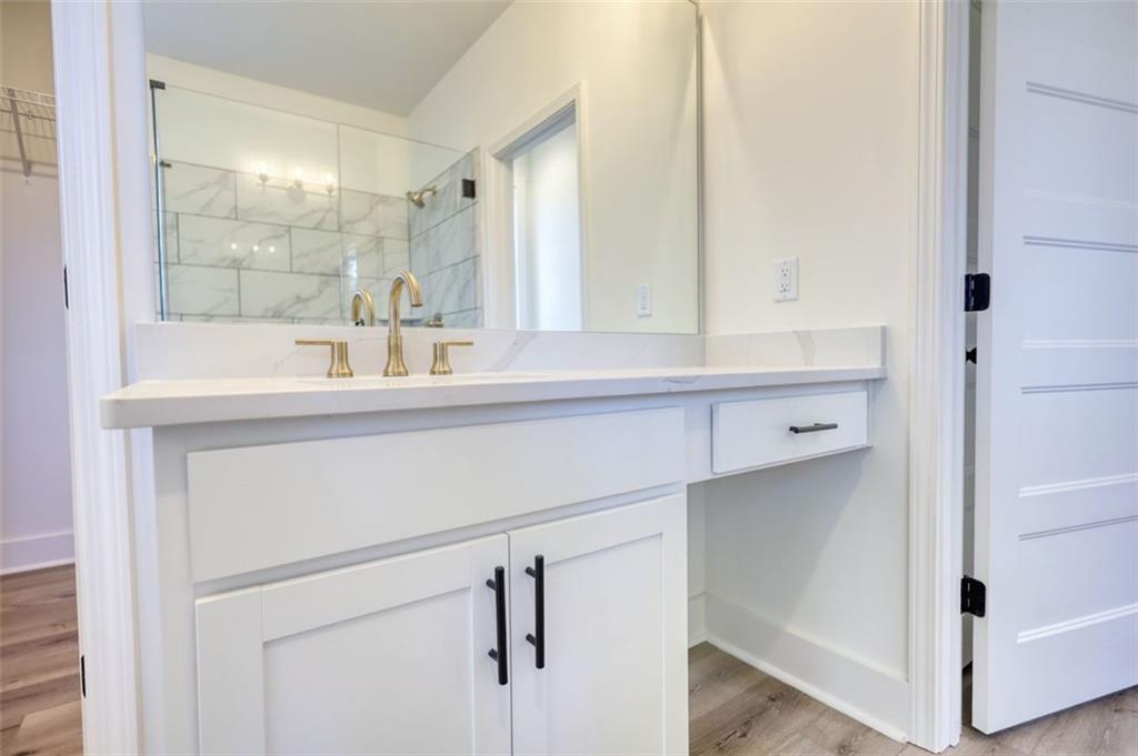 160 Loyd Road Mansfield, GA 30055 - Photo 49 of 82 a bathroom with a sink and a mirror