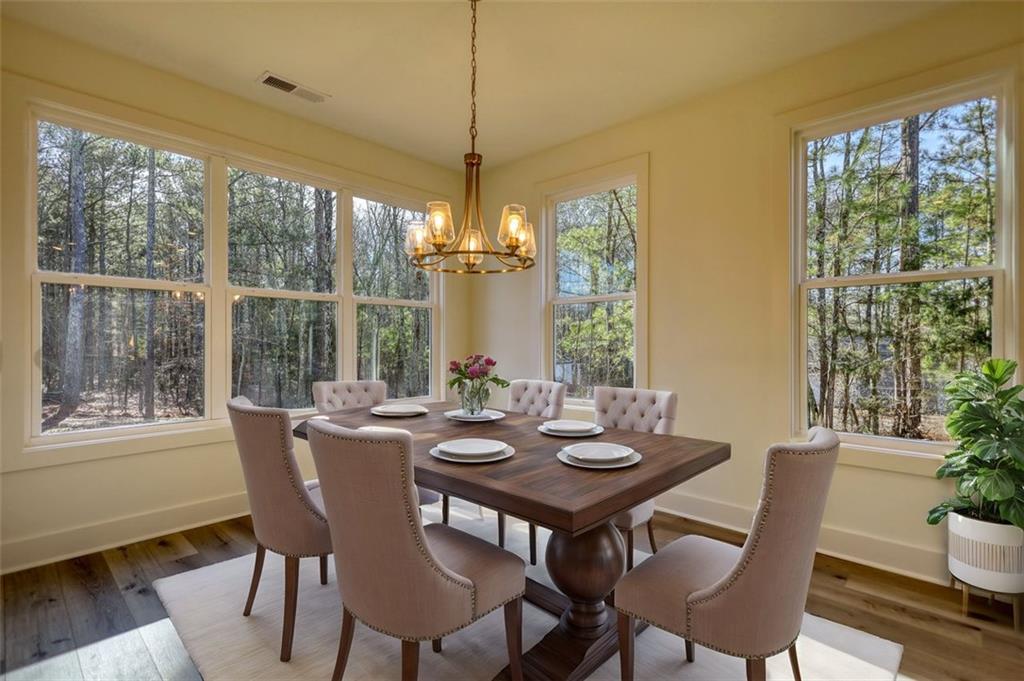 160 Loyd Road Mansfield, GA 30055 - Photo 68 of 82 a view of a dining room with furniture window and wooden floor