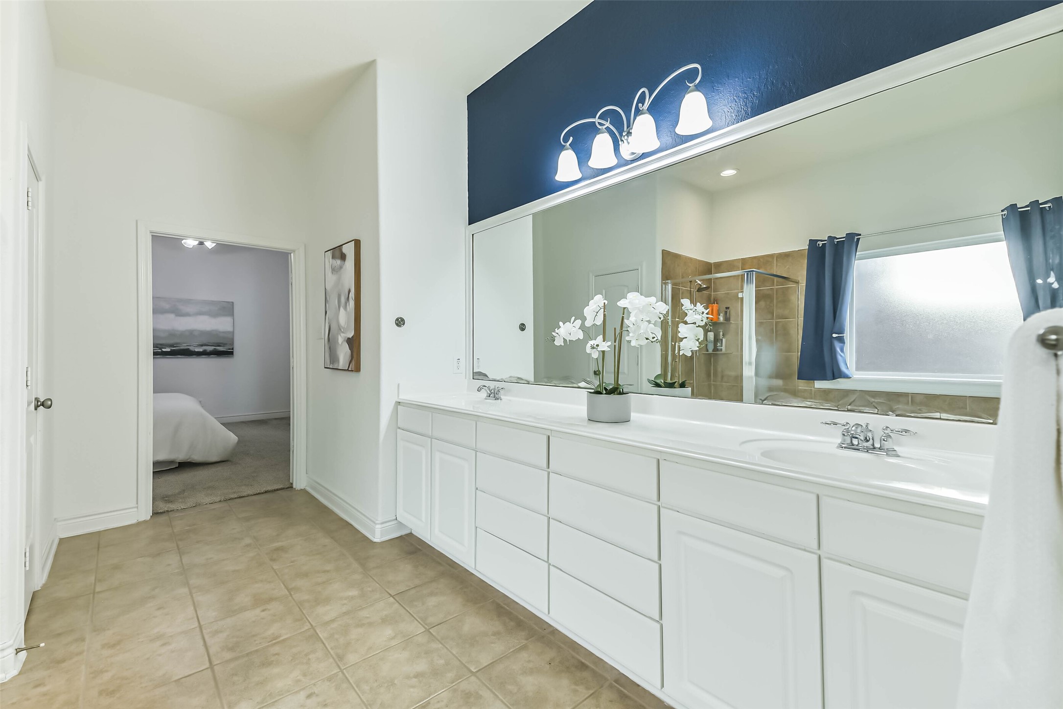 19022 Greenleaf Ridge Court Cypress, TX 77429 - Photo 27 of 47 a bathroom with a sink and mirror