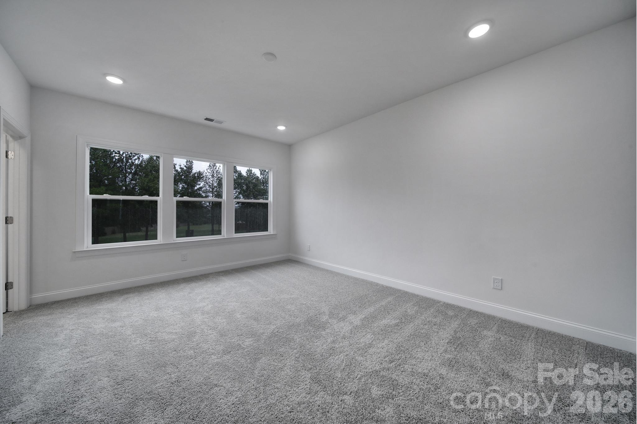 9220 Walnut Hl Road Northwest Concord, NC 28027 - Photo 11 of 14 a view of an empty room with a window
