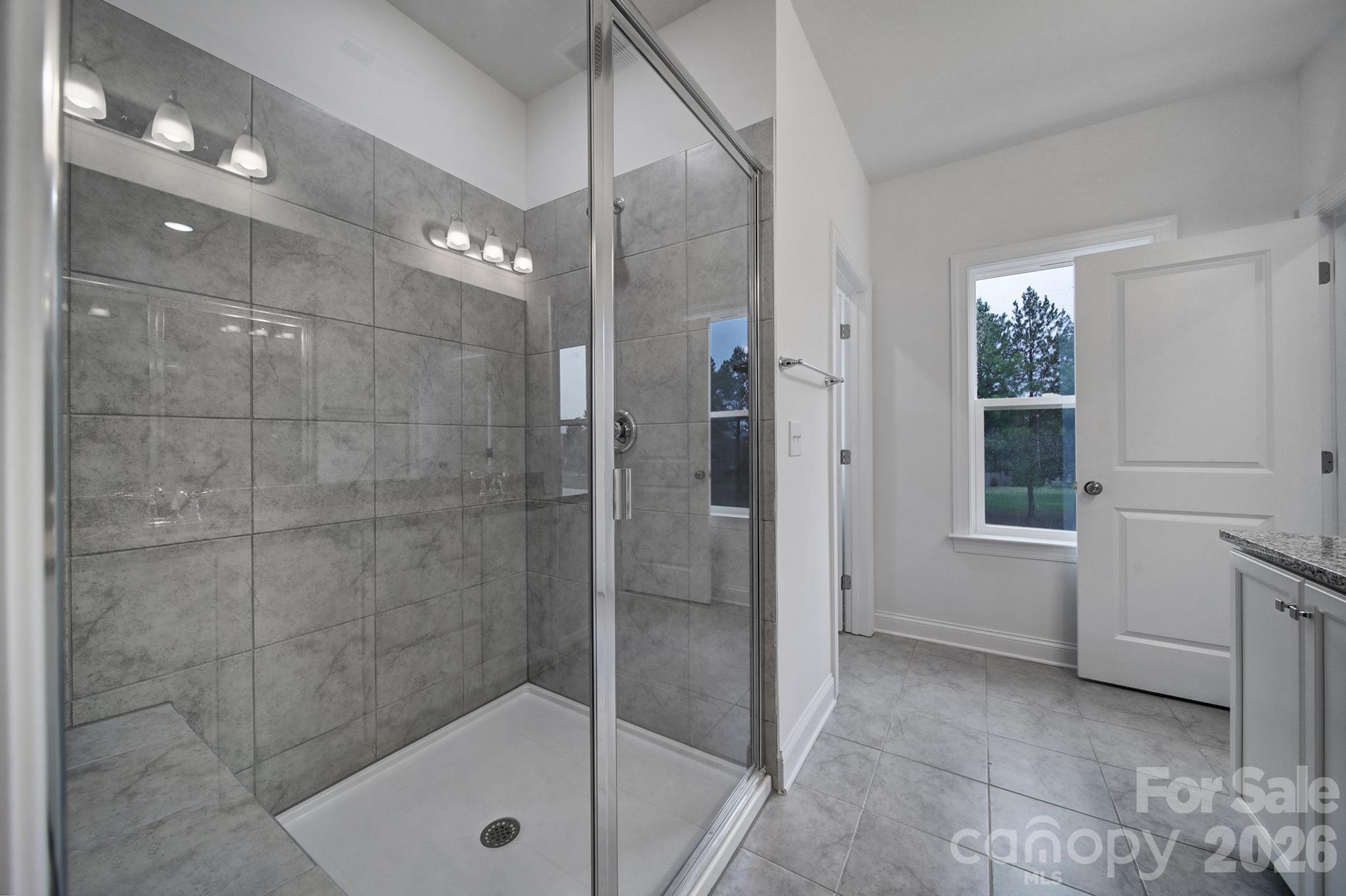 9220 Walnut Hl Road Northwest Concord, NC 28027 - Photo 13 of 14 a bathroom with a shower