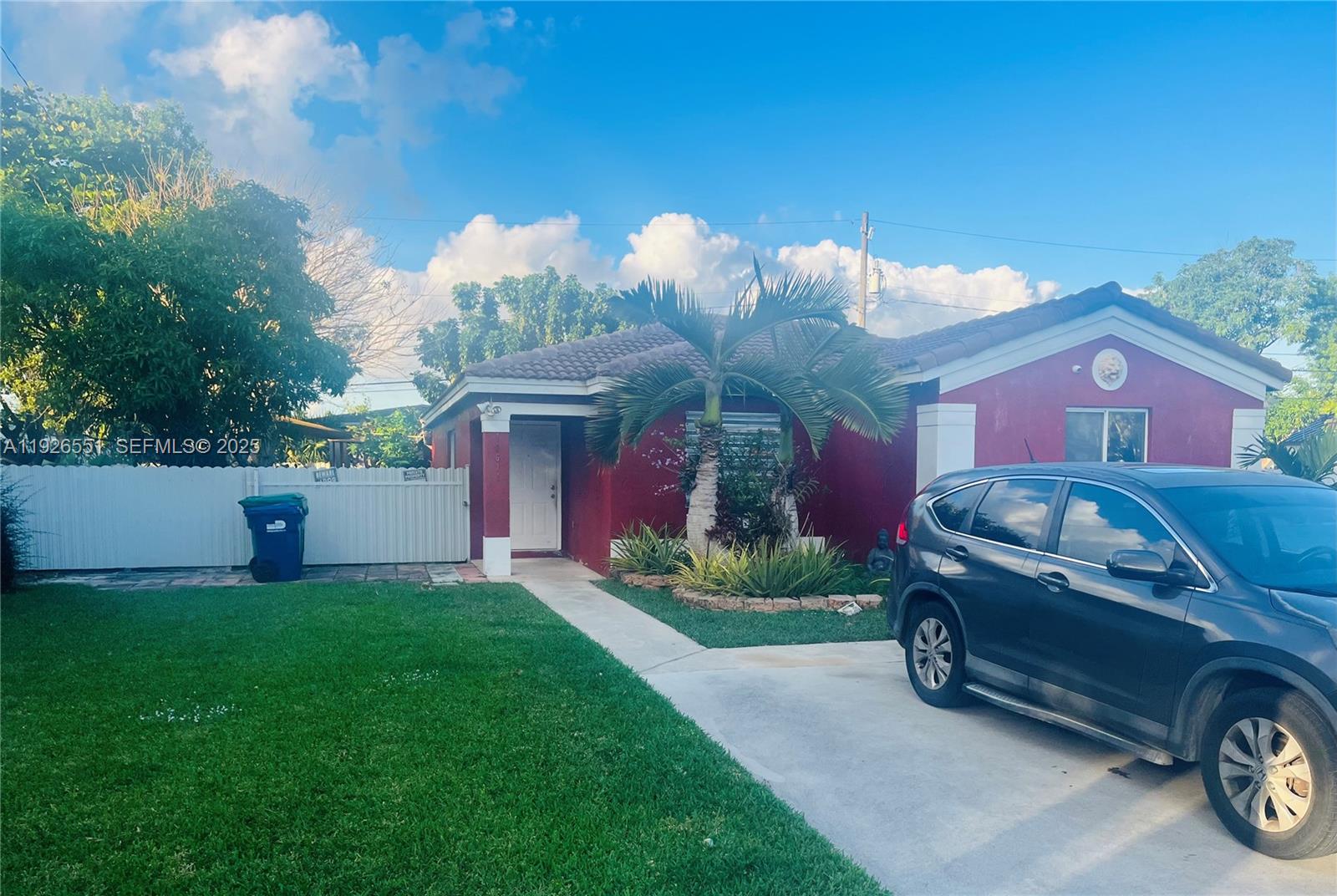 10611 Southwest 170th Terrace Miami, FL 33157 - Photo 3 of 23 a front view of a house with garden