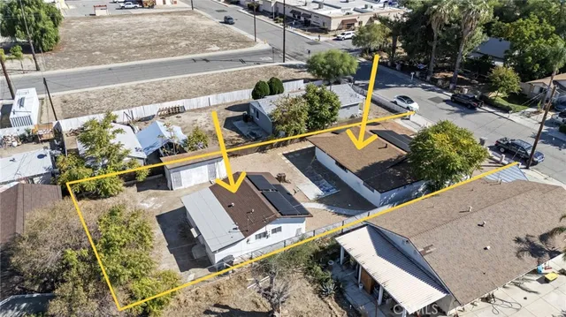 an aerial view of a house with outdoor space