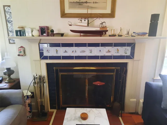 a kitchen with sink a stove and cabinets