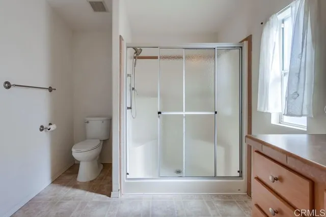 a bathroom with a sink vanity and mirror