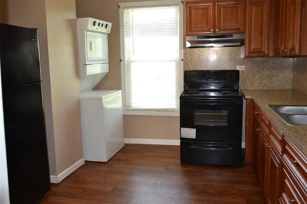 a kitchen with appliances and cabinets