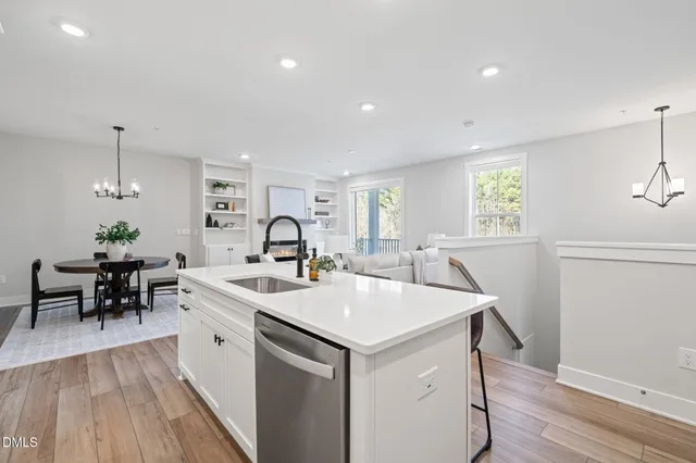 a view of a a dining table chairs and wooden floor