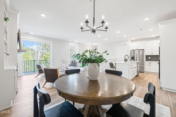 a dining room with furniture and window