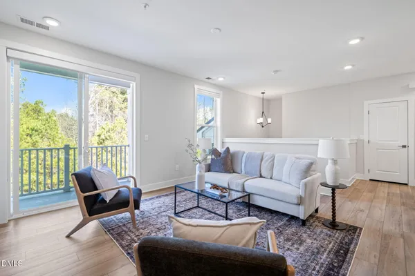 a living room with furniture or couch and a large window