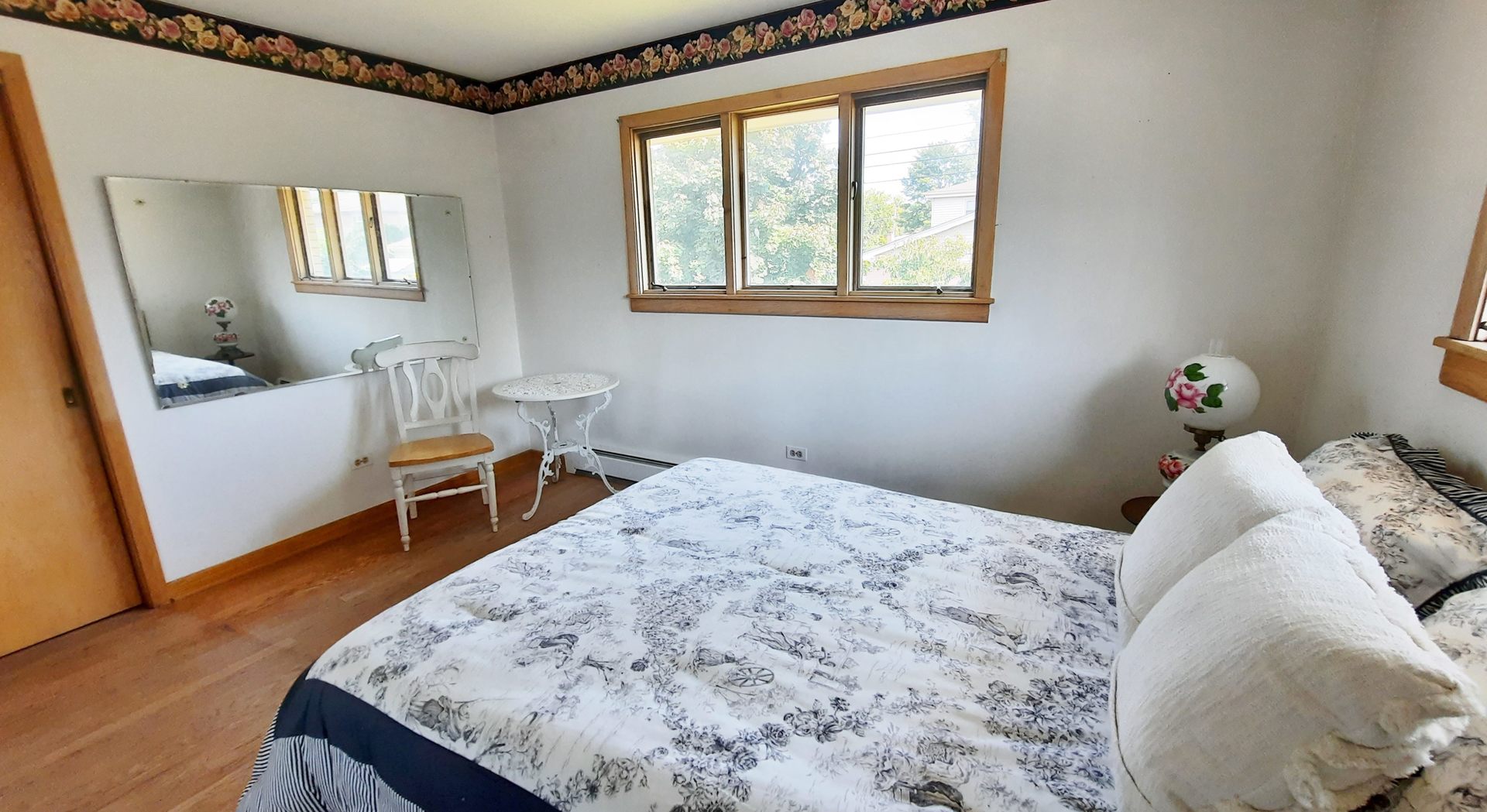 423 North Aldine Avenue Park Ridge, IL 60068 - Photo 17 of 25 a bedroom with a bed and wooden floor