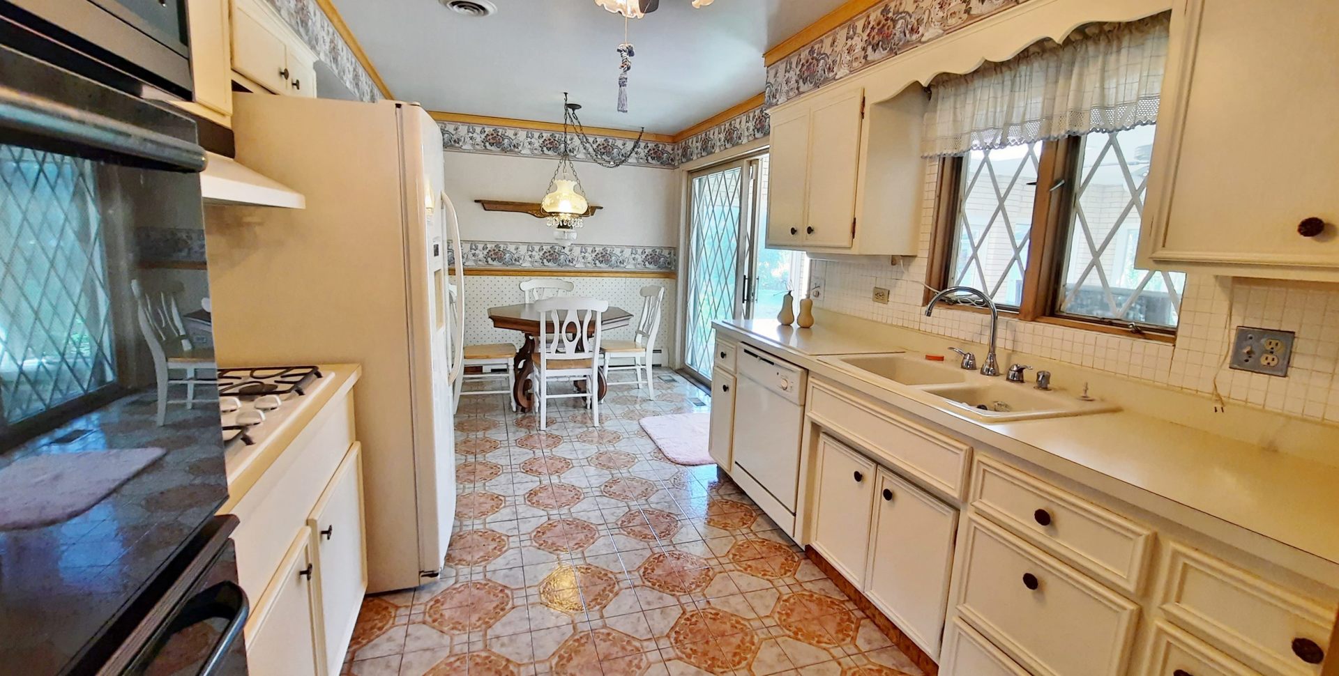 423 North Aldine Avenue Park Ridge, IL 60068 - Photo 5 of 25 a large kitchen with stainless steel appliances a sink stove and cabinets