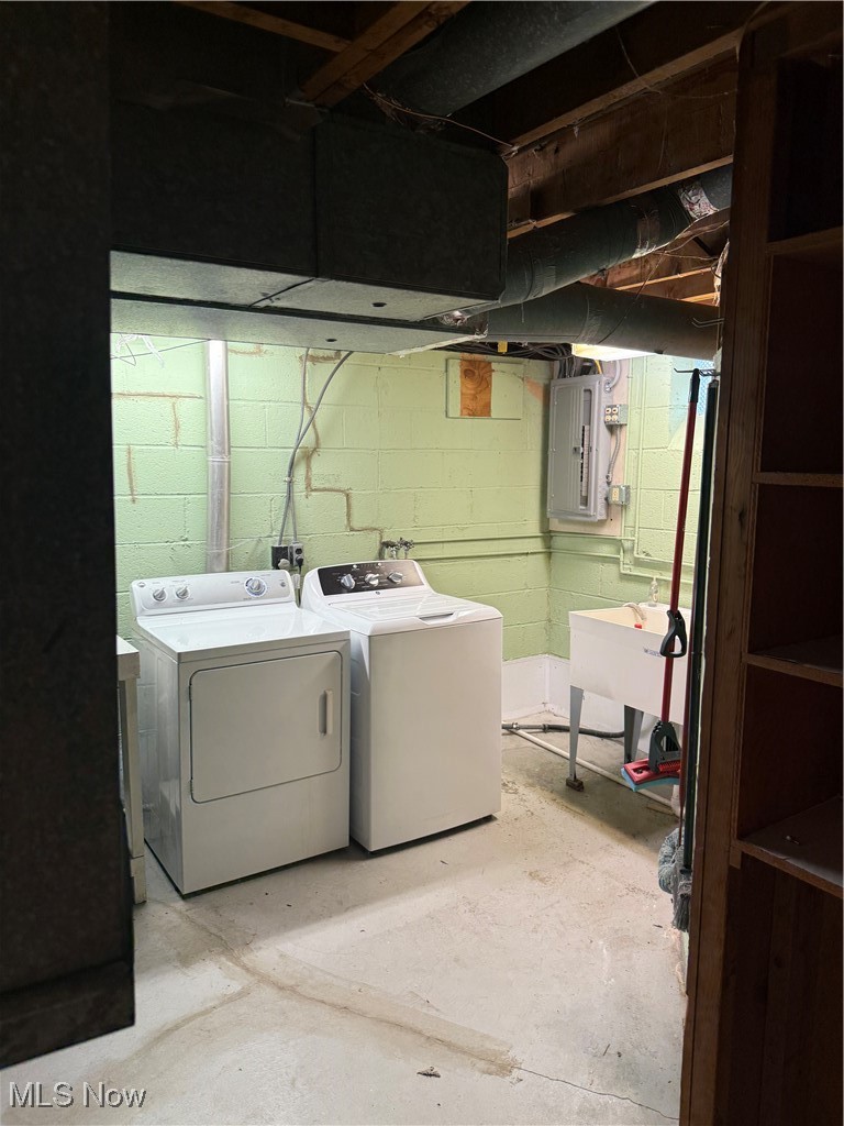 1284 Haverston Road Lyndhurst, OH 44124 - Photo 41 of 43 Washroom featuring unfinished concrete flooring, independent washer and dryer, and electric panel
