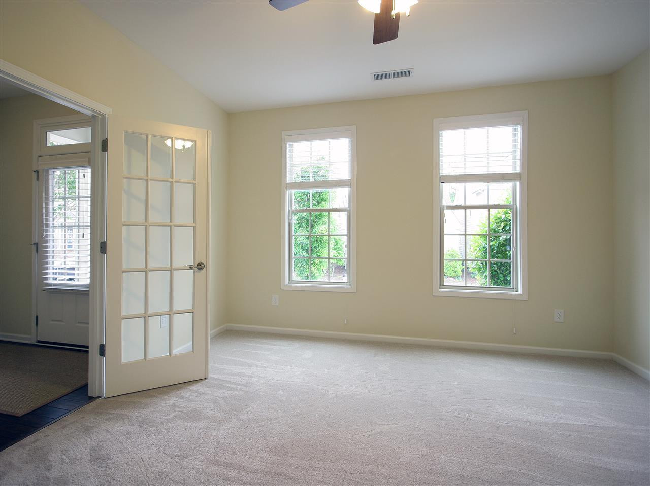 1517 Rodessa Run Raleigh, NC 27607 - Photo 14 of 25 Bedroom #4 is on the main level and is perfect for guests. Or use as a home office, exercise room, media room, craft room, play room, or game room. French doors lead to the foyer. There is a full bath on this level. Bedroom #4 or Office