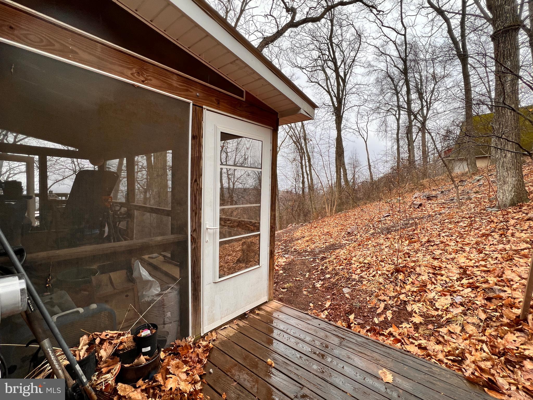 2777 Audubon Road Hedgesville, WV 25427 - Photo 7 of 60 Screened porch.