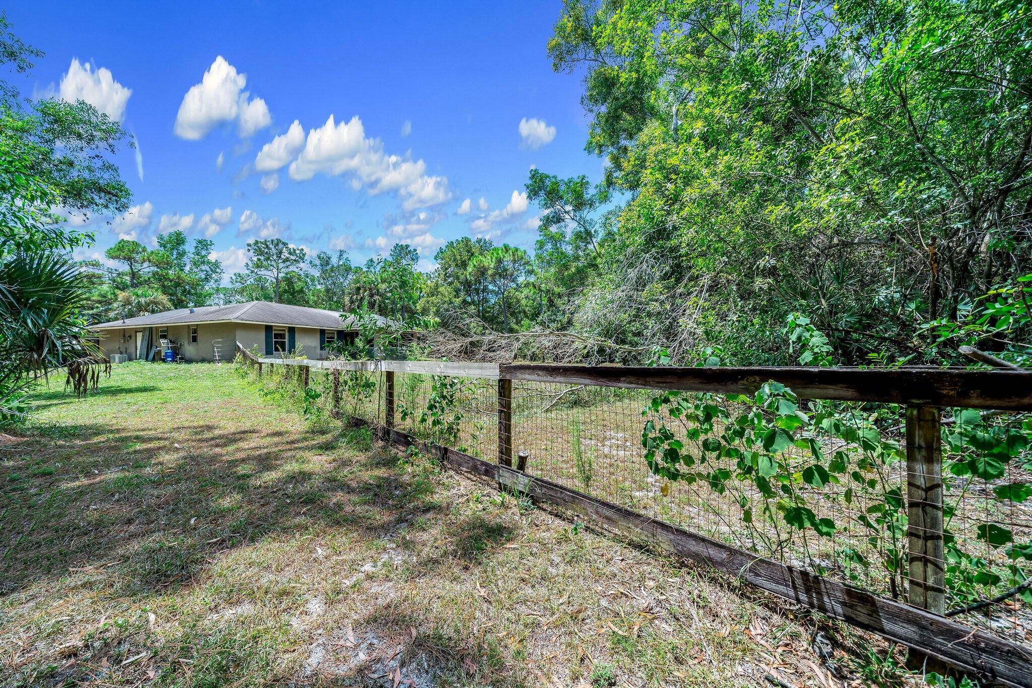 17645 Winterhawk Trail Jupiter, FL 33478 - Photo 35 of 45 EAST SIDE OF HOUSE
