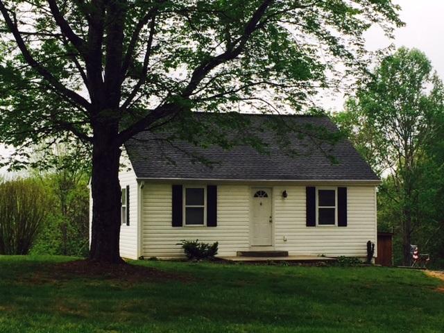 10153 Goodview Road Goodview, VA 24095 - Photo 1 of 15 a front view of house with yard and green space