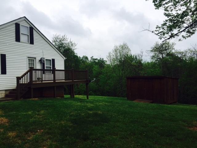 10153 Goodview Road Goodview, VA 24095 - Photo 14 of 15 a view of a backyard with potted plants and large trees