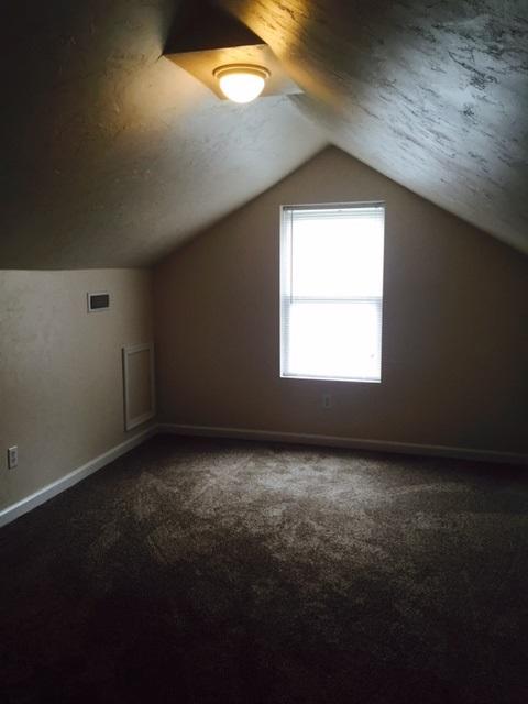 10153 Goodview Road Goodview, VA 24095 - Photo 9 of 15 an empty room with a window