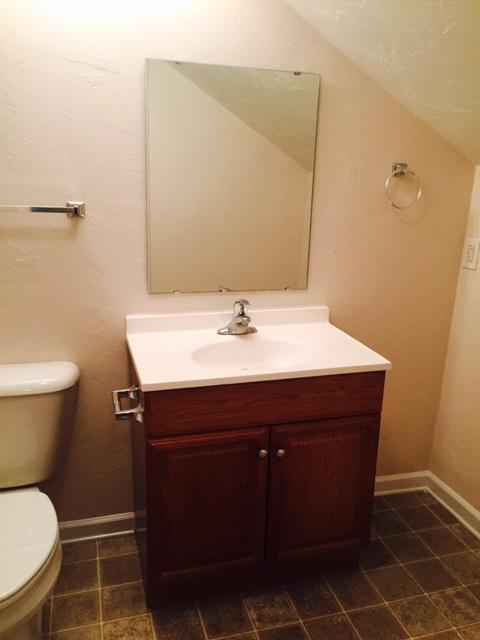 10153 Goodview Road Goodview, VA 24095 - Photo 10 of 15 a bathroom with a sink toilet and mirror