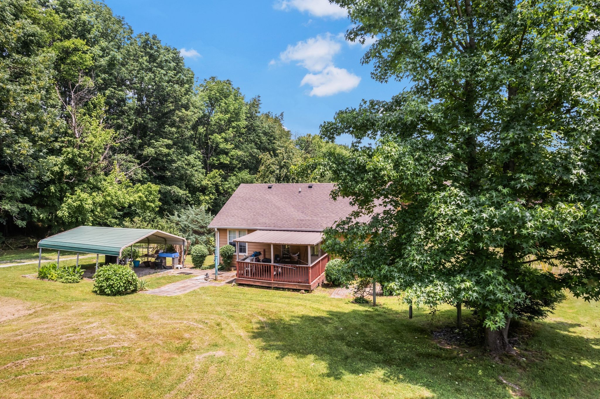 7898 Highway 41 Adams, TN 37010 - Photo 4 of 10 a view of a house with a yard and sitting area