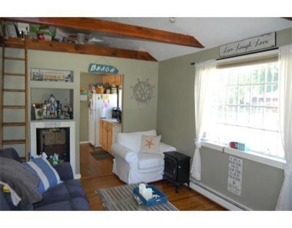 36 Turner Road Scituate, MA 02066 - Photo 3 of 3 a living room with furniture and a fireplace