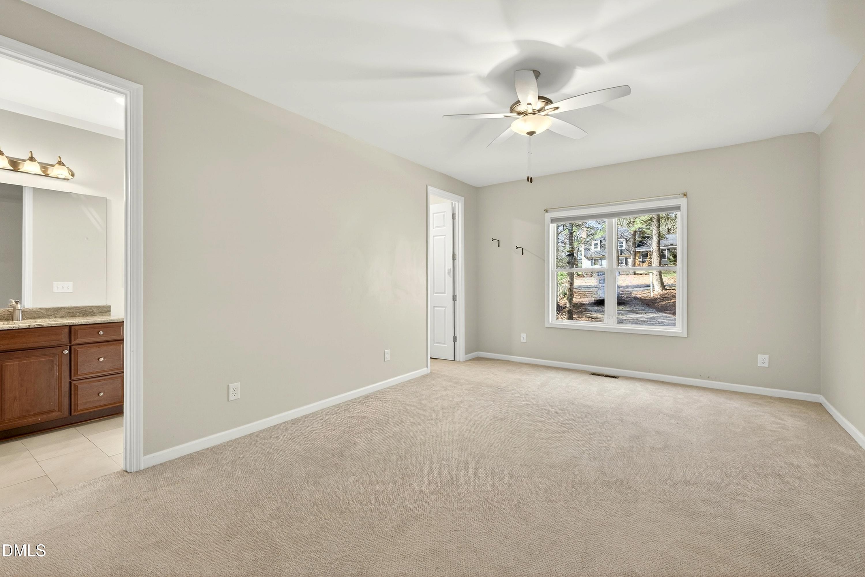 810 Woodland Road Creedmoor, NC 27522 - Photo 39 of 77 a view of an empty room with a window