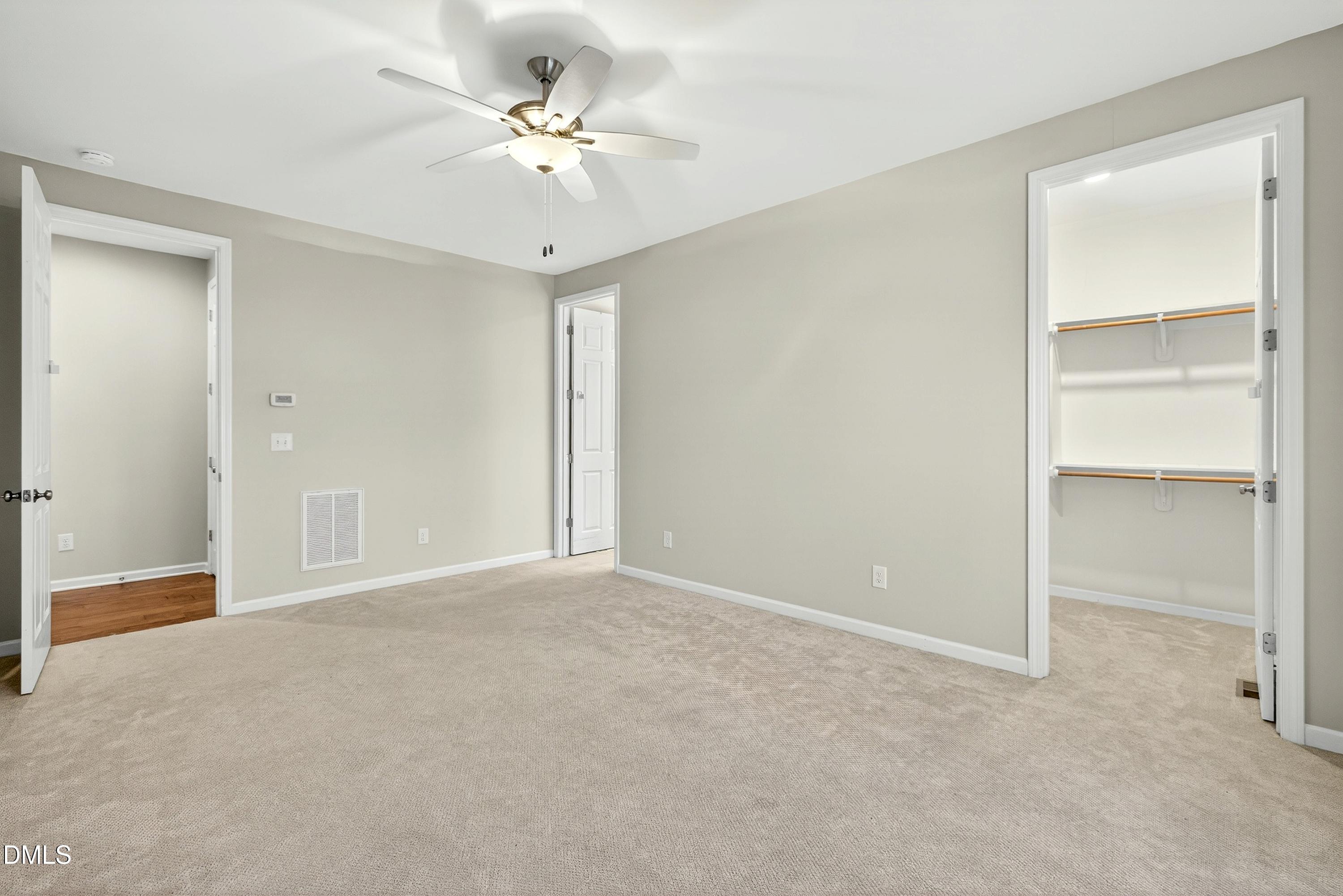810 Woodland Road Creedmoor, NC 27522 - Photo 40 of 77 a view of an empty room with a ceiling fan