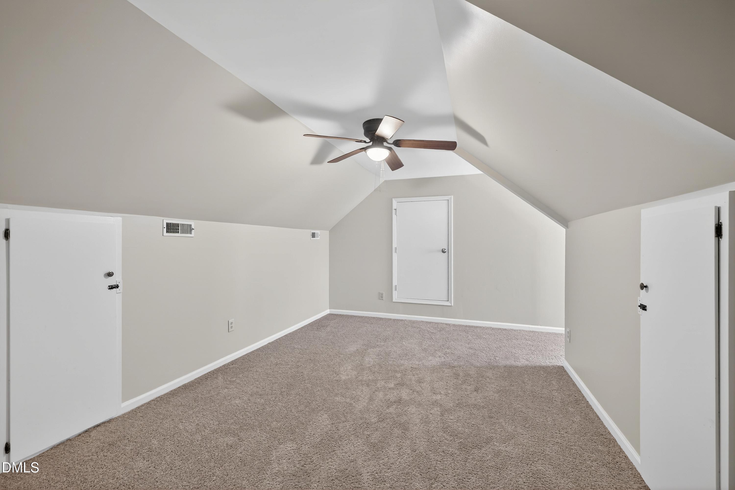 810 Woodland Road Creedmoor, NC 27522 - Photo 44 of 77 a view of an empty room with a ceiling fan