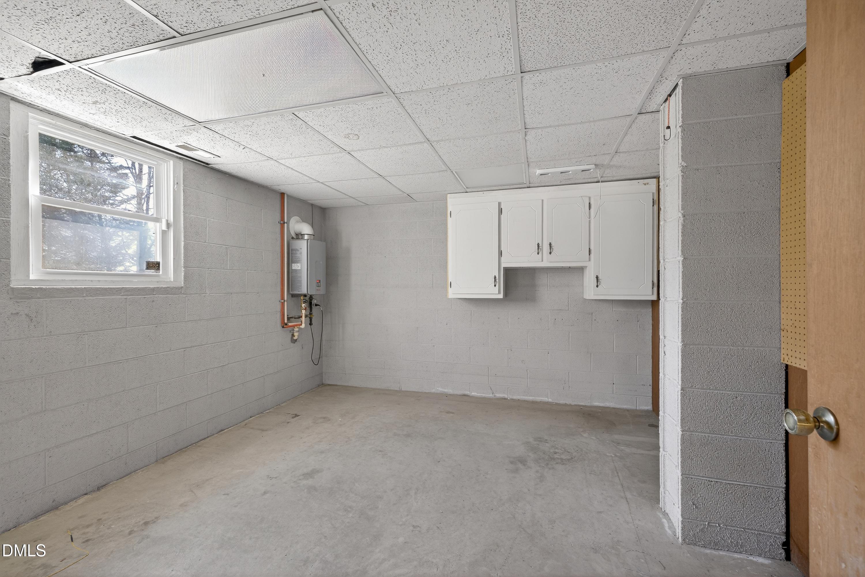 810 Woodland Road Creedmoor, NC 27522 - Photo 52 of 77 a view of a livingroom with an empty space