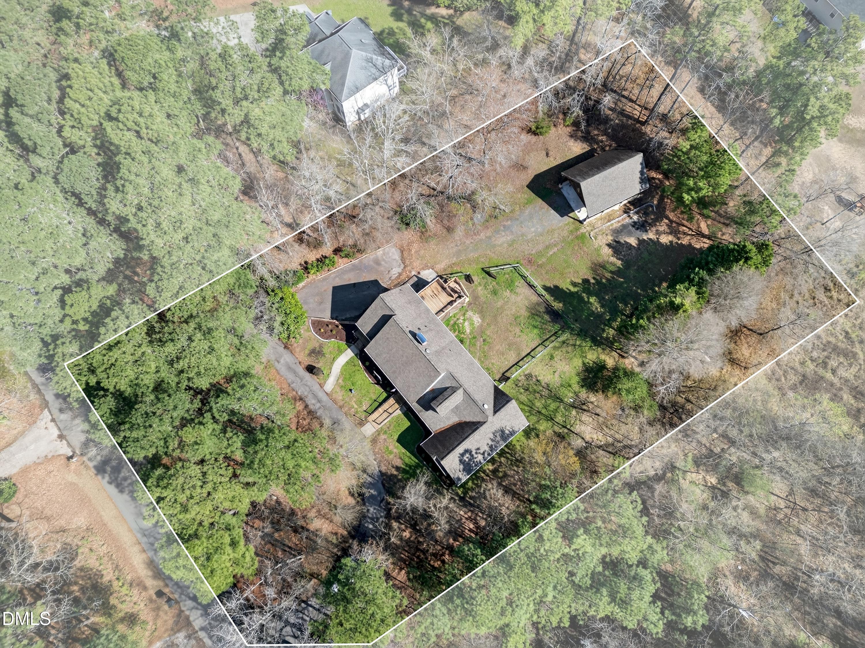 810 Woodland Road Creedmoor, NC 27522 - Photo 70 of 77 an aerial view of a house with a yard