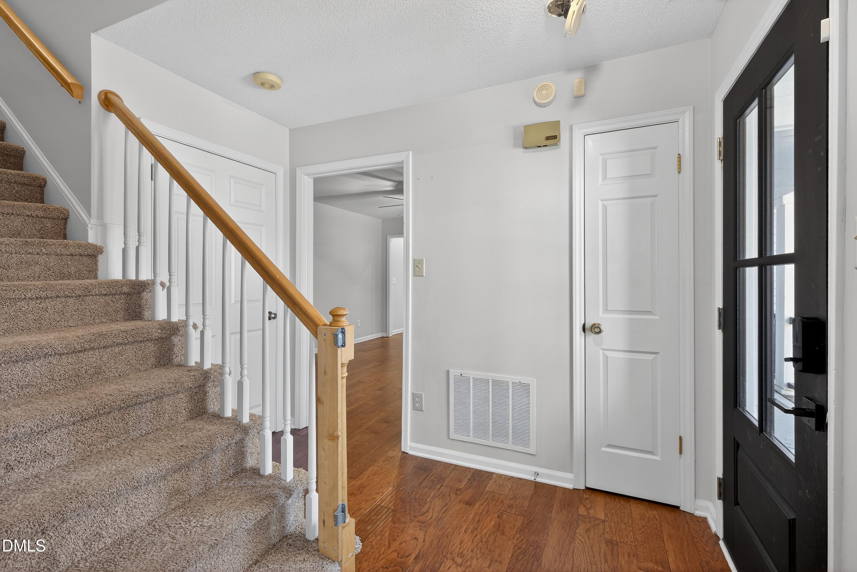 810 Woodland Road Creedmoor, NC 27522 - Photo 7 of 77 a view of a hallway with wooden floor and entryway